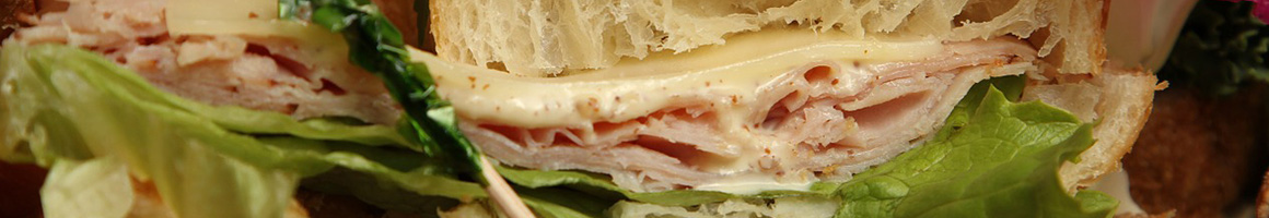 Eating Deli Sandwich at Code 10 restaurant in Boston, MA.